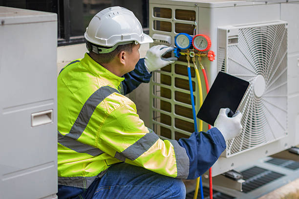Professional Air Duct Cleaning technician working in DeLand, FL
